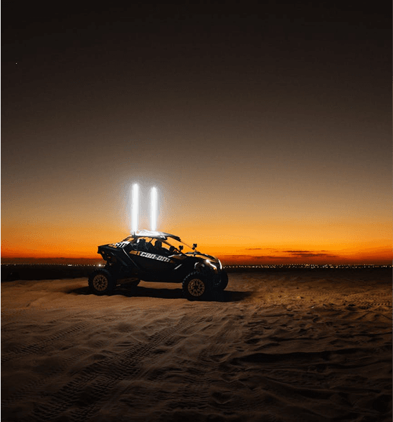 Dune buggy at sunset in the desert